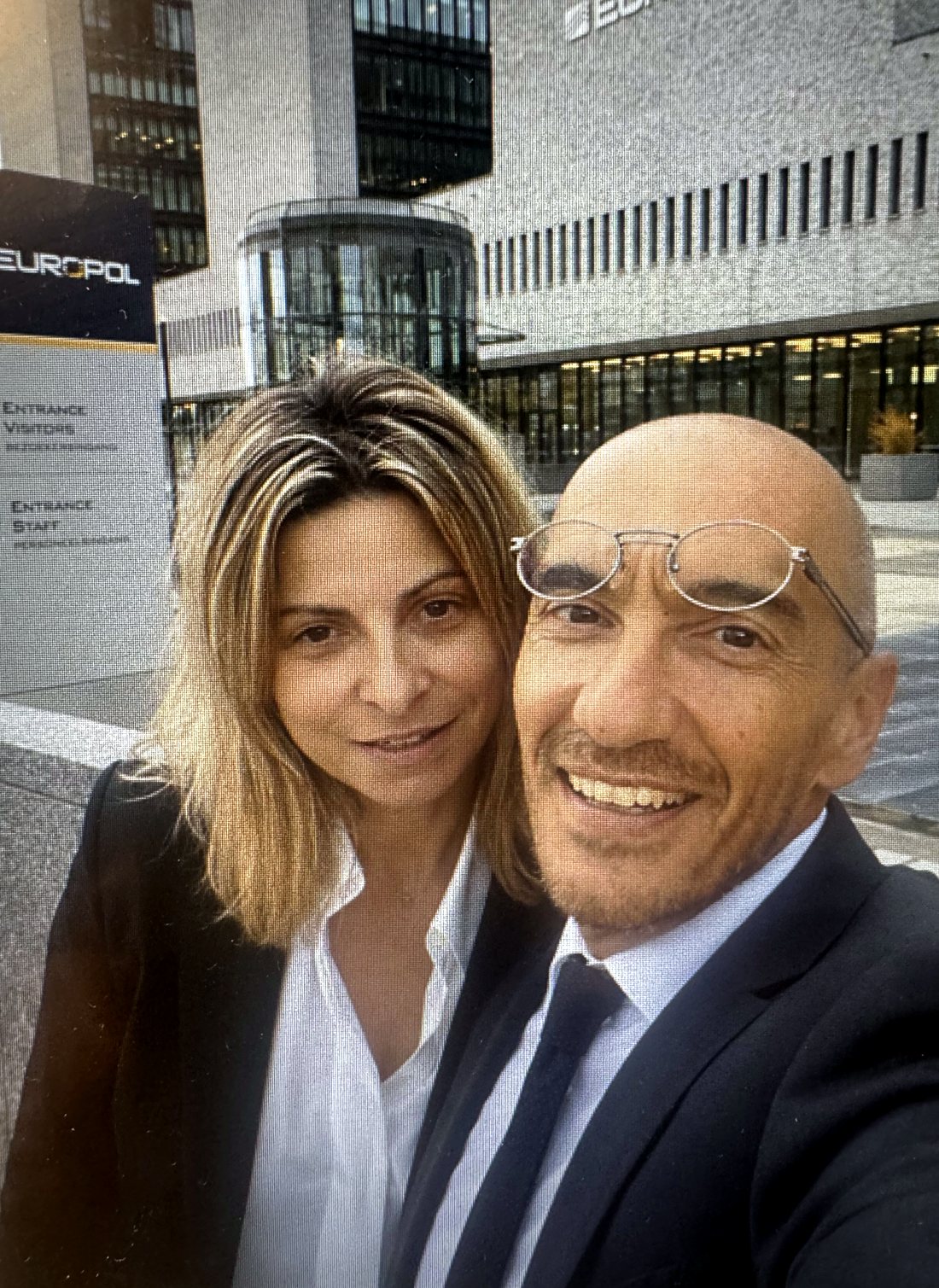 Two participants outside the visitors' entrance of Europol, in The Hague