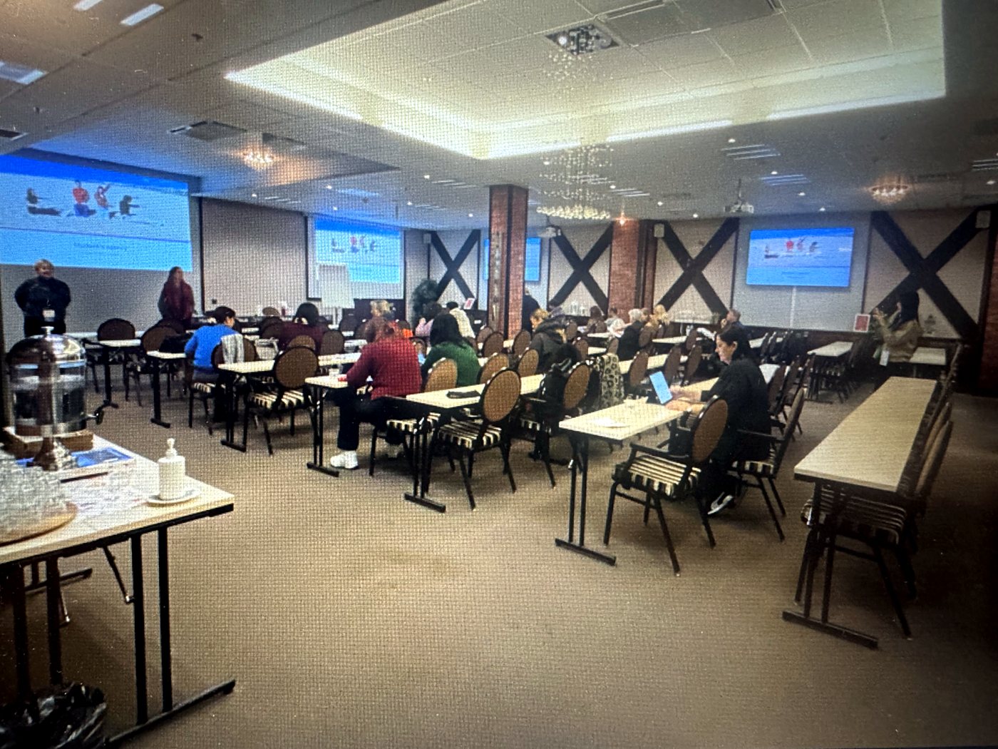 Participants in a training room during a presentation